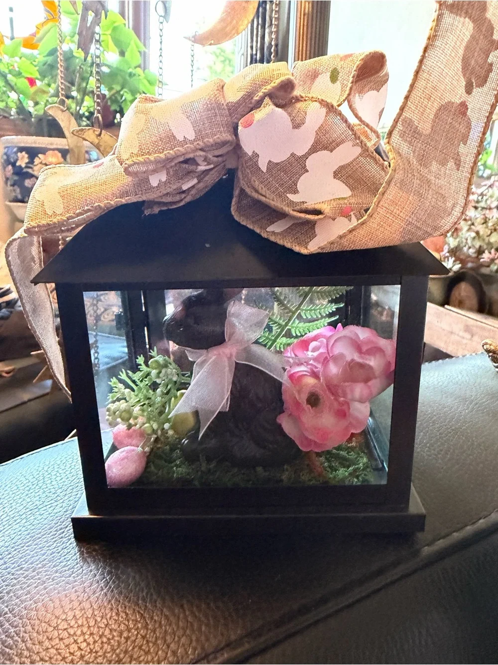 Glass & metal terrarium with artificial flowers and bunny rabbit figurine